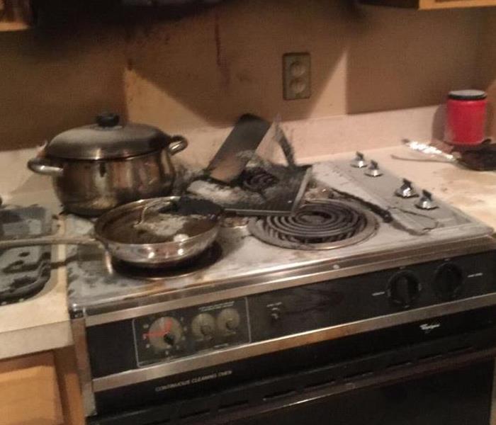 stove that has been burned from food left unattended