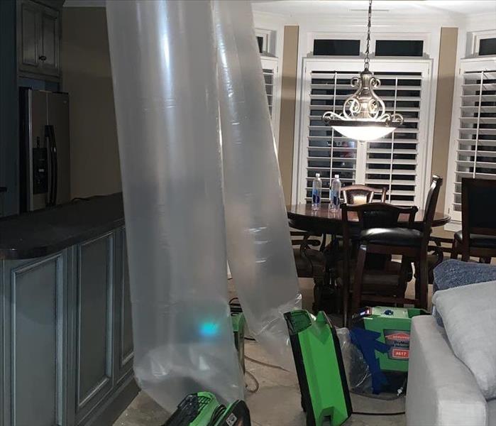 SERVPRO drying fans drying water damage to home